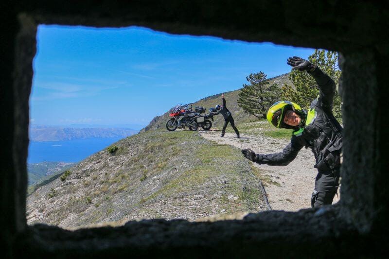 Scenic view with motorcycle tour riders